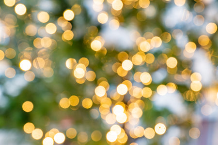 Bokeh abstract texture. Beautiful christmas background in golden colors. defocused image