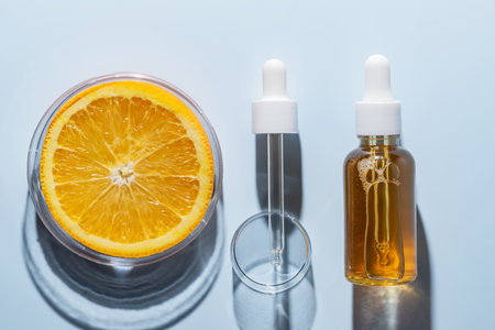 Natural cosmetics laboratory research, bio science, organic skin care, orange fruits and cosmetic oils, beauty from nature. AHA exfoliation testingの写真素材
