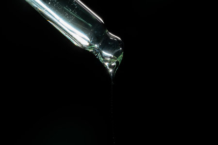 liquid aqua serum lotion dropper of beauty cosmetic skincare on black background