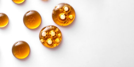 Drops of yellow oil swatch texture macro with bubbles, cosmetics for face and body, science,...