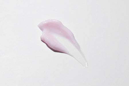 pink cosmetic cream texture, skincare lotion swatch on white background. Face creme, body moisturizer, hair conditioner smear smudge stroke. Creamy beauty product closeupの写真素材