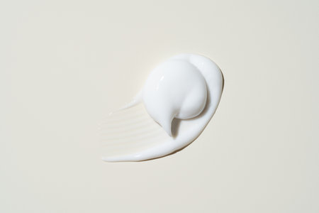Buttery skincare texture mid-stroke, showing effortless blendability and hydration for beauty product visuals.の写真素材