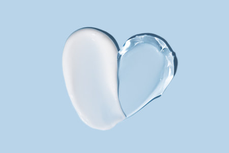 Soothe cream lotion moisturizer gel smears on blue background. Skincare and body beauty product. Liquid gel cosmetic smudgesの写真素材