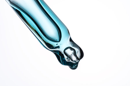 Cosmetic pipette with oil on white background close-up. Stylish concept of organic essences, beauty and health products. Modern apothecary. Close upの写真素材