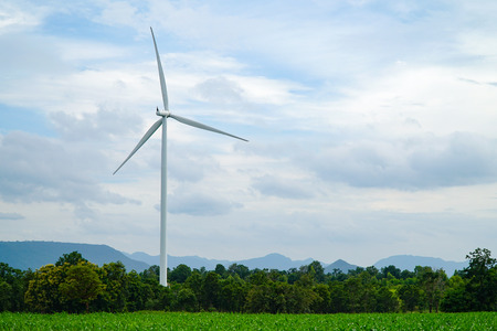 Wind turbines Eco power with green meadowの写真素材