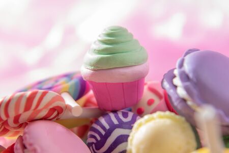Toys. Cake and different colored round candy. Candy backgroundの写真素材