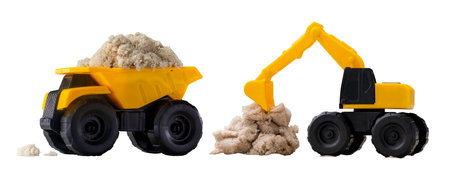 two small toy construction excavators with kinetic sand on white background.の写真素材