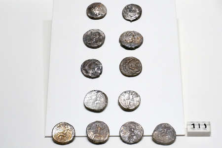 Ancient coins displayed at the National Museum of the Kingdom of Saudi Arabia in Riyadh, Middle East. Photo taken on August 9, 2017.のeditorial素材
