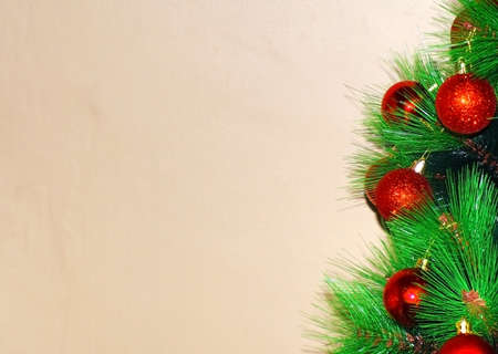 Christmas tree with red bubbles on defocus light brown background. An image for Christmas background with copy space for texts or messages.の写真素材