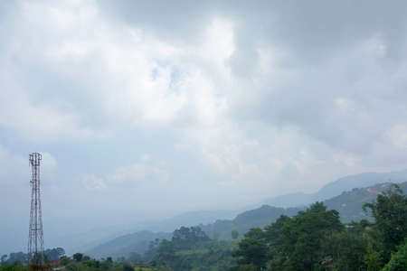A Tower and Cloudy Sky. Weather condition affecting reception of mobile phones and internet.の写真素材
