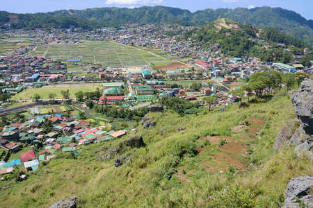 View of residential and agricultural farm with few commercial area in a mountainous area in the Philippines. Photo taken in Benguet, Philippines, Southeast Asia on February 16, 2017.のeditorial素材