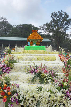 Various flowers such as red everlasting, white chrysanthemum, pink orchids and leaves arranged to resemble stair and house. Photo taken in Baguio, Philippines, Southeast Asia on March 1, 2015.のeditorial素材