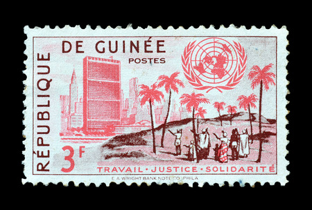 GUINEA - CIRCA 1959 : Postage stamp printed by Ecuador that shows UN Headquarters in New York and People of Guinea.のeditorial素材