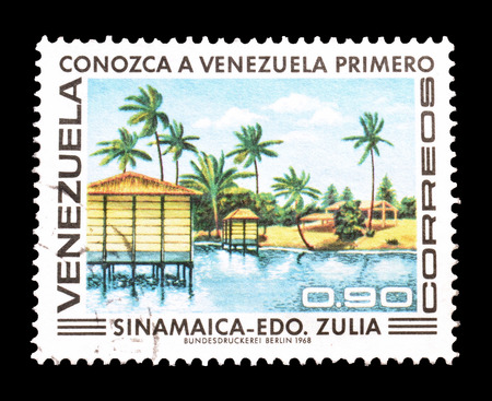 VENEZUELA - CIRCA 1968 : Postage stamp printed by Venezuela, that shows wooden cottages on water.のeditorial素材