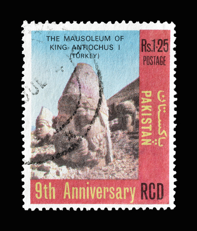 Cancelled postage stamp printed by Pakistan, that shows Head from mausoleum of King Antiochus I, circa 1973.のeditorial素材