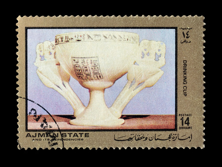 Cancelled postage stamp printed by Ajman state, that shows Drinking cup, circa 1972.のeditorial素材