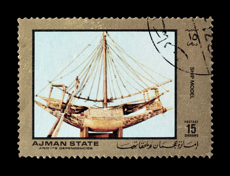 Cancelled postage stamp printed by Ajman state, that shows ship model, circa 1972.のeditorial素材