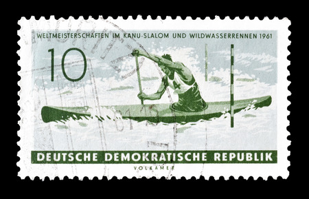 Cancelled postage stamp printed by German Democratic Republic, that shows Canoe, circa 1961.のeditorial素材