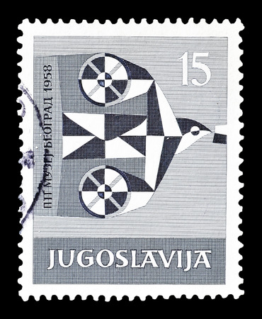 Cancelled postage stamp printed by Yugoslavia, that shows stylized pigeon, circa 1958.のeditorial素材
