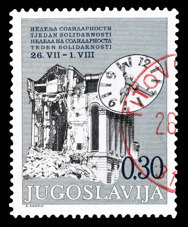 Cancelled postage stamp printed by Yugoslavia, that shows ruin and clock, circa 1975.のeditorial素材