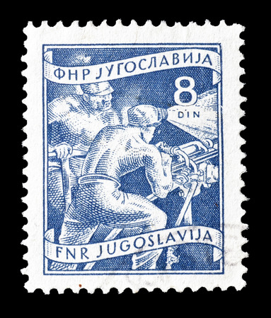 Cancelled postage stamp printed by Yugoslavia, that shows mining, circa 1953.のeditorial素材