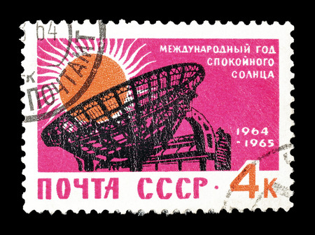 Cancelled postage stamp printed by Soviet Union, that shows Antenna and sun, circa 1964.