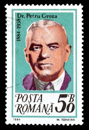 Cancelled postage stamp printed by Romania, that shows Dr Petru Groza, circa 1984.のeditorial素材