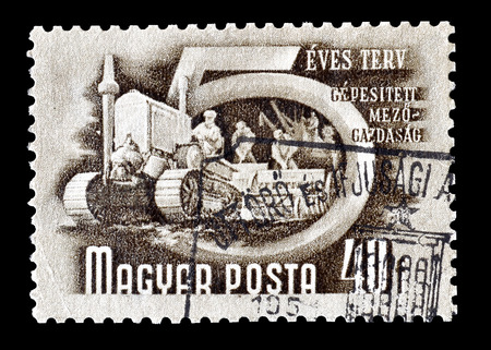 Cancelled postage stamp printed by Hungary, that shows Mechanized agriculture, circa 1950.のeditorial素材