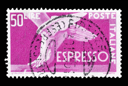 Cancelled postage stamp printed by Italy, that shows winged foot, circa 1951.のeditorial素材