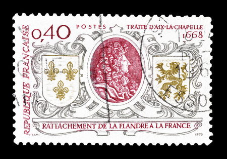 Cancelled postage stamp printed by France, that shows Louis XIV, Arms of France and Flanders, circa 1968.のeditorial素材