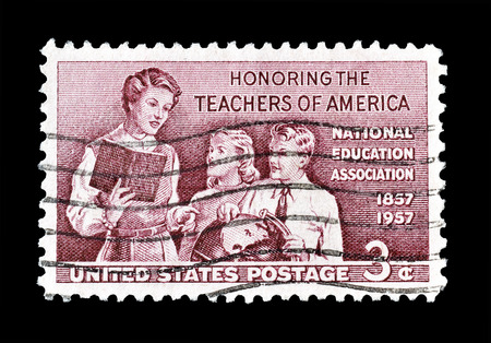 Cancelled postage stamp printed by USA, that shows Teacher and children, circa 1957.のeditorial素材