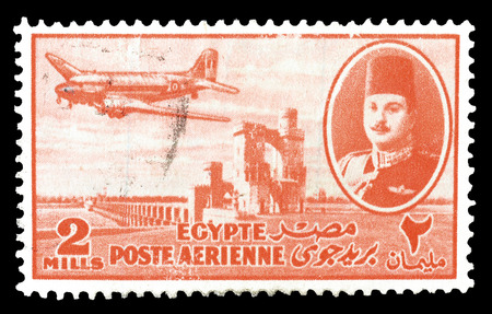Cancelled postage stamp printed by Egypt, that shows king Farouk Delta Dam and airplane, circa 1947.のeditorial素材