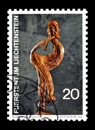 Cancelled postage stamp printed by Liechtenstein, that shows wooden sculpture, circa 1972.のeditorial素材