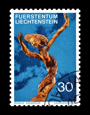 Cancelled postage stamp printed by Liechtenstein, that shows wooden sculpture, circa 1972.のeditorial素材