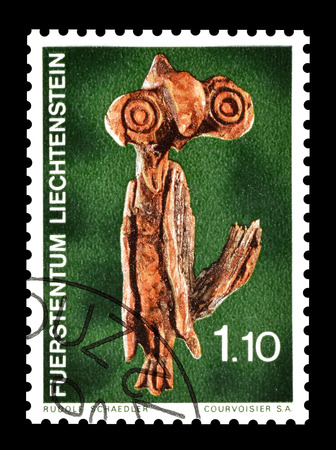 Cancelled postage stamp printed by Liechtenstein, that shows wooden sculpture, circa 1972.のeditorial素材