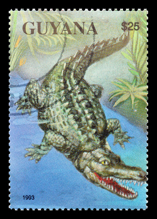 Cancelled postage stamp printed by Guyana, that shows Crocodile, circa 1993.のeditorial素材