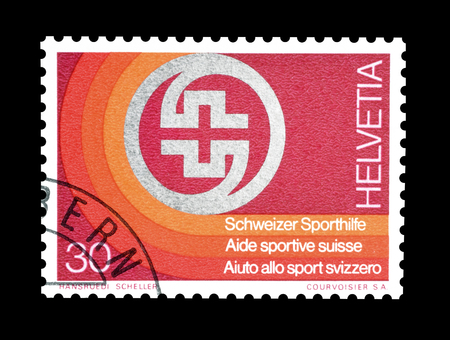 Cancelled postage stamp printed by Switzerland, that shows Badge of Swiss Sport Aid, circa 1974.のeditorial素材