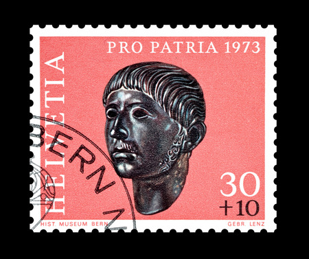 Cancelled postage stamp printed by Switzerland, that shows Gallic head, circa 1973.のeditorial素材