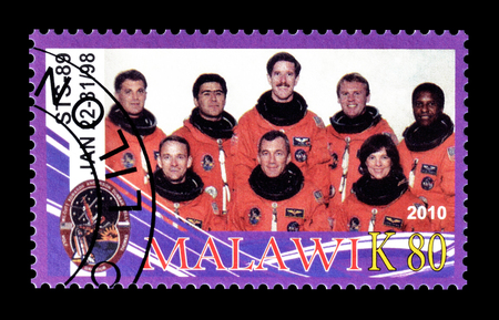 Cancelled postage stamp printed by Malawi, that shows astronauts, circa 2010.のeditorial素材