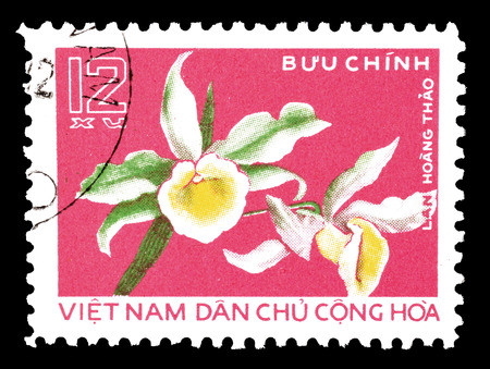 Cancelled postage stamp printed by Vietnam, that shows Orchid, circa 1976.のeditorial素材
