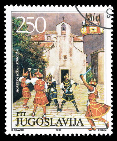 Cancelled postage stamp printed by Yugoslavia, that shows Traditional dance in Korcula, circa 1987.のeditorial素材