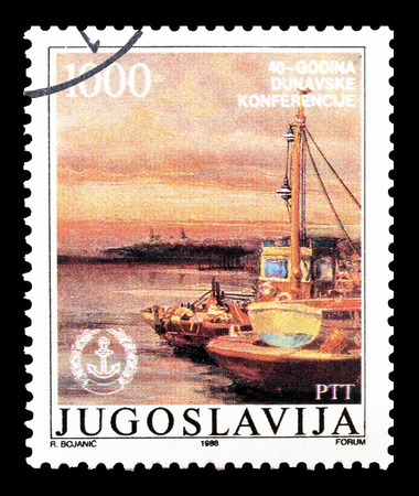 Cancelled postage stamp printed by Yugoslavia, that shows Harbor at Danube, circa 1988.のeditorial素材