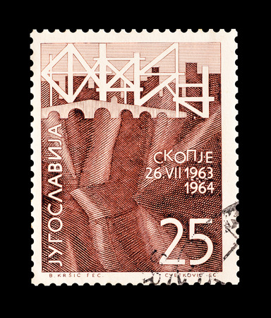 Cancelled stamp printed by Yugoslavia, that shows Earthquake in Skopje, circa 1964.のeditorial素材
