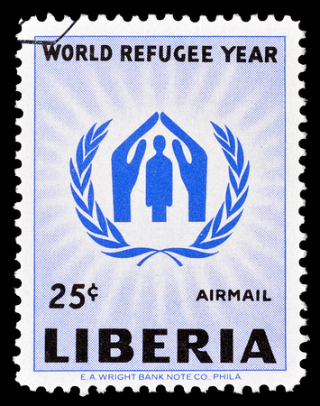Cancelled stamp printed by Liberia, that shows Refugee emblem, circa 1960.のeditorial素材