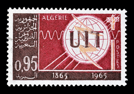 Cancelled stamp printed by Algeria, that shows UIT Emblem, circa 1965.のeditorial素材