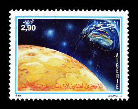 Cancelled stamp printed by Algeria, that shows Mars and Earth, circa 1989.のeditorial素材