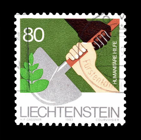 Cancelled postage stamp printed by Liechtenstein, that shows Humanitarian aid, circa 1983.のeditorial素材