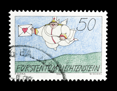 Cancelled postage stamp printed by Liechtenstein, that shows Love messenger, circa 1992.のeditorial素材