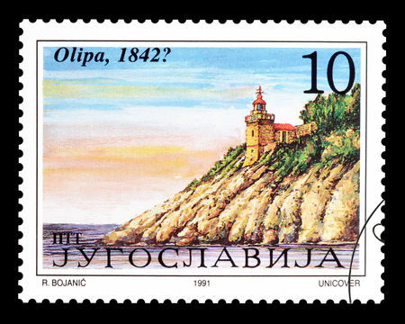 Cancelled postage stamp printed by Yugoslavia, that shows  Lighthouse Olipa, circa 1991.のeditorial素材