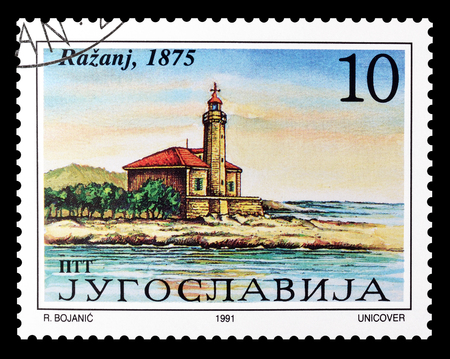 Cancelled postage stamp printed by Yugoslavia, that shows  Lighthouse Razanj, circa 1991.のeditorial素材